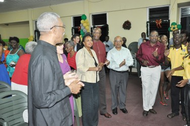 The People’s National Congress Reform (PNCR) Headquarters was the scene of a spirited Concert last evening.  A release from Congress Place said that the air was filled with Christmas cheer, songs, dances and the spoken word, as the Party held its annual Yuletide celebration. PNCR Leader David Granger (left) and invitees singing Christmas carols. (PNCR photo)