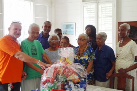 Matron of the Gentle Women’s Home, Ruby Cummings receives the hamper (GINA photo)
