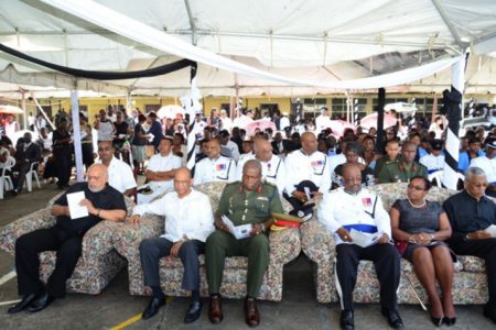 (From left) President Donald Ramotar, Home Affairs Minister Clement Rohee , Chief of Staff of the Guyana Defence Force Brigadier Mark Phillips, Police Commissioner Leroy Brummel, a relative of Derrick Josiah, and Opposition Leader David Granger among the gathering at the funeral of the late Assistant Police Commissioner on Saturday. (GINA photo)