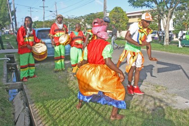 Masqueraders along Camp Street today