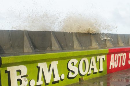 High tides today overtopping the wave wall built by the Ministry of Public Works opposite the Russian Embassy in Kitty.