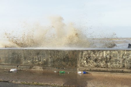 Overtopping of the seawall today parallel to Carifesta Avenue.