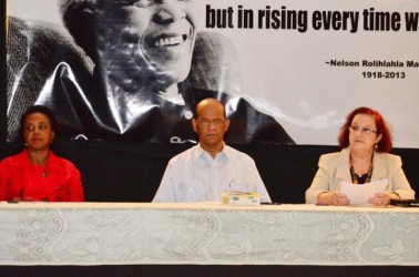 General Secretary of the PPP Clement Rohee (centre) with Central Committee Member of the PPP Gail Teixeira (right) and United Nations Development Programme Country Representative Khadija Musa at the ‘Night of Reflection’ for Nelson Mandela at the Umana Yana on Monday. (GINA photo)