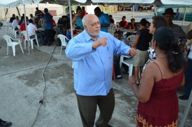 Showing his moves, President Donald Ramotar cuts the barriers at the party hosted by the Rice Producers Association  at Crane, West Coast Demerara on Friday. (GINA photo)