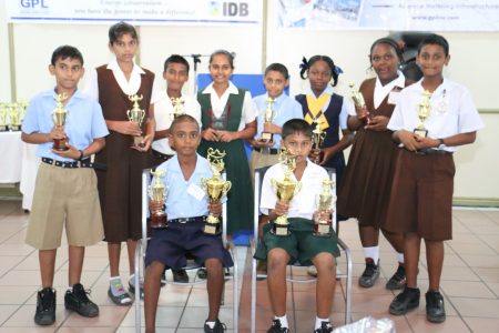 Awardees of the Guyana Power and Light/Inter-American Development Bank’s  National Spelling Bee following the competition’s finals this morning posing with their prizes. Sitting are finalists Travis Williams (left) who was adjudged runner-up and Daniel Premsukh (right), the winner.