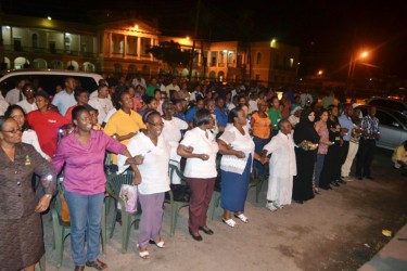 The gathering in front of Parliament last night at the domestic violence vigil. (GINA photo)