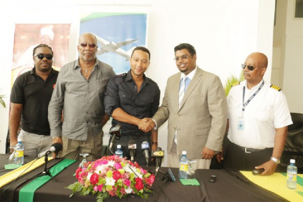 Concert ready: John Legend  (third from left) shaking hands with Tourism Minister irfaan Ali yesterday. Also in photo from left are Rawle Ferguson of Hits and Jams, Odinga Lumumba and Captain Ronald Reece of Fly Jamaica.  Legend will headline a concert today at the Providence Stadium. 