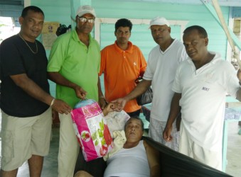 Members of the BLUCC delivering items to one of the shut-ins 