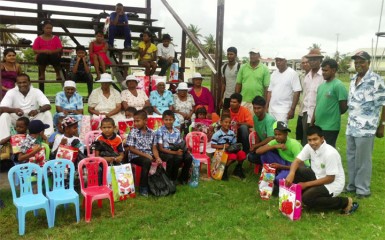 Saywack (left) and other members and a donor posing with the recipients