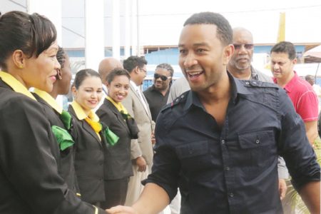 The legend is here: Grammy award winner John Legend arrived here yesterday afternoon for his much-anticipated concert. Here he greets Fly Jamaica crew members at the Ogle International Airport. The Night of Love Concert, an event organised by McNeal Enterprises in collaboration with Hits and Jams Entertainment is set for today at the Guyana National Stadium, Providence.
The show will also see performances by Caribbean reggae icon, Beres Hammond and Chutney sensation, KI & JMC 3Veni.  (Arian Browne photo)