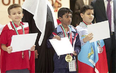 Indian Praggnanandhaa at centre, stands proudly with his gold medal in the Boys Under 8 category of the World Youth Championships. Praggnanandhaa is already a FIDE master with a FIDE rating of 1852. He won all of his games in the championships and is flanked at left by Isik Can of Turkey (silver) and Elshan Sulymanli Aydin from Azerbaijan. 