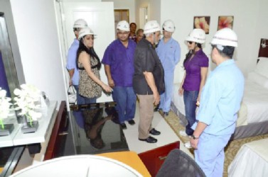 President Donald Ramotar (centre) inspecting one of the model rooms at the Marriott Hotel (GINA photo) 