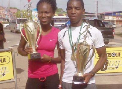 Alika Morgan and Kelvin( Johnson posing with their spoils after Sunday’s Bigi Broki Waka 10km road race which was staged Paramaribo, Suriname.
