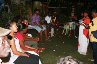 Guliana Jacobs speaking to Kwakwani youths