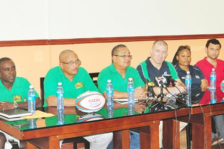 Regional Development Officer (RDO) of North America Caribbean Rugby Association (NACRA), Scott Harland makes a point at yesterday’s media briefing as executive members of the GRFU look on. (Orlando Charles photo)