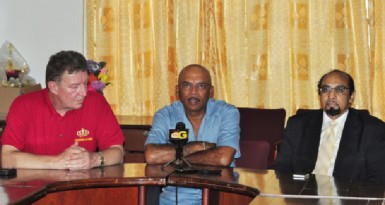 From left Great Britain rifle shooting coach Ian Shaw, national full-bore captain Mahendra Persaud and GOA president K.A Juman Yassin. (Orlando Charles photo) 