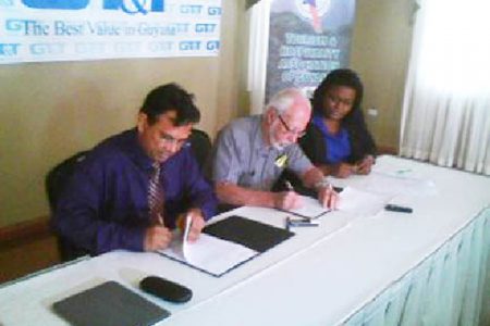 From left to right are GT&T CEO, Radha Krishna Sharma; President of THAG Kit Nascimento and GT&T Public Relations Officer Allison Parker, at the signing of the sponsorship agreement between GT&T and THAG.
