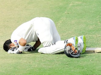 Shehzad dropped to the ground in thanks after scoring his maiden Test ton in the evening session. (photo Cricket365) 