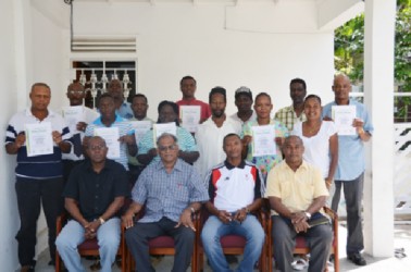 AIBA certified referee/judge, James Beckles (second from right seated) poses with participants of the referee and coaching workshop which concluded yesterday at the GOA building. He is also flanked by executive members of the GBA and Director of Sport Neil Kumar.  