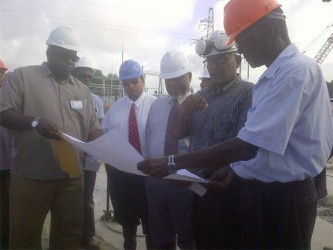 From right: Project Coordinator Lennox McGregor, Chairman of the Guyana Power and Light (GPL) Board of Directors  Winston Brassington, Prime Minister Samuel Hinds, Chief Executive Officer (CEO) Bharrat Dindyal and, and Divisional Director Narvon Persaud 