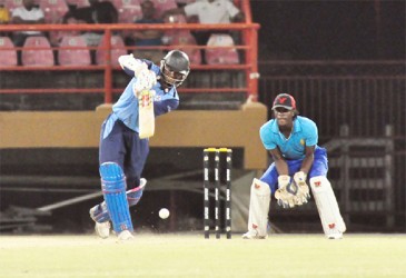 Shivnarine Chanderpaul driving during his innings of 77 yesterday. (Orlando Charles photo)