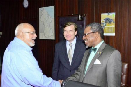 This GINA photo shows President Donald Ramotar (left) receiving Dr Ivelaw Griffith. At centre is US Ambassador Brent Hardt.