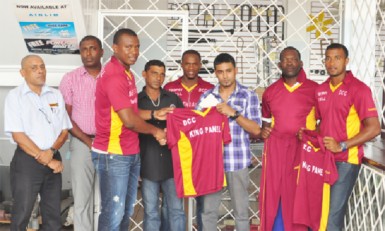 National skipper Christopher Barnwell receives a club T-shirt from the sponsors, while DCC President Alfred Mentore (second from left) and other players look on.  