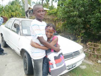 Keron and his sister Rodessa dressed to go out