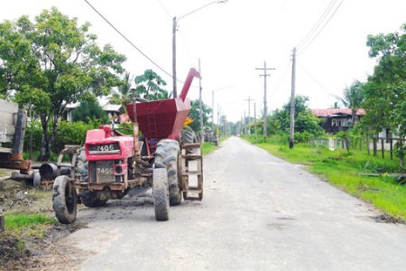 A tractor parked along the roadway