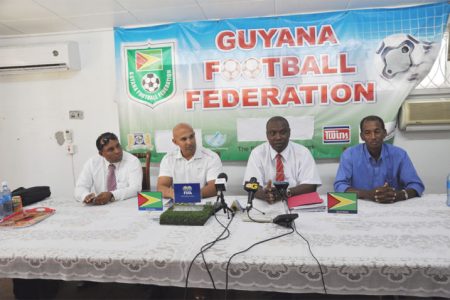 GFF President Christopher Matthias addressing the gathering at a brief press conference yesterday at the entity’s section K Campbellville office while GFF Vice President Ivan Persaud (extreme left), Technical Director Mark Rodrigues (left) and GFF executive Committee member Keith O’Jeer (right) look on.
