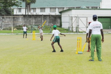 Action in the Scotiabank Kiddies cricket competition at the Georgetown Cricket Club ground, Bourda on Thursday. 