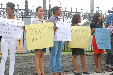 Some of the protesters near Parliament today condemning the police treatment of Colwyn Harding.  Harding has alleged that he was sodomized by a policeman with a baton and beaten among other indignities. He is now hospitalized at the Georgetown Hospital.