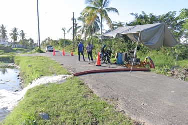 The Ministry of Public Works today draining the flooded Le Repentir Cemetery by pumping water into the Sussex Street trench.