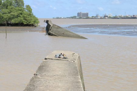 This broken jetty on the West Demerara is located near to Plastic City