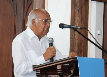 Communications expert Rafiq Khan delivering a tribute at Terry Holder’s funeral on Wednesday