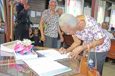 Signing the book of condolence