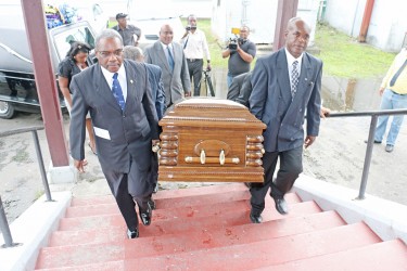 The coffin bearing the remains of Terry Holder being borne into St Andrews Kirk today.