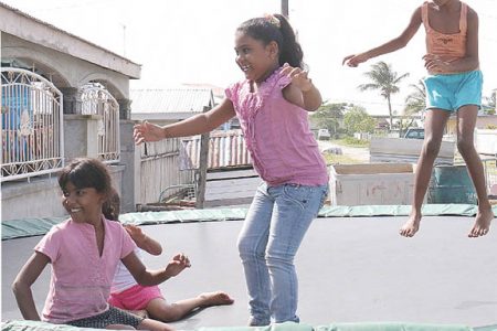 These young ladies were having fun on the trampoline at Jaden’s birthday party.