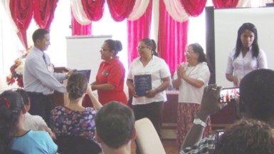 (from left to right) GBTI Lethem manager André Yhap presenting plaques to the 4 finalists - Rosamund Benn (Pomeroon women’s), Alicia Gouveia (Waini Naturals) Ayli Cenepo Quinteros (Peru), Ebelin Patricia Solorzano (Peru) 