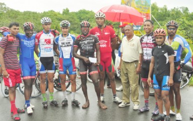 Winner’s Row The prize winners of yesterday’s NSC sponsored 40-mile road race take a photo opportunity with the event’s organizer, Hassan Mohamed. (Orlando Charles photo) 