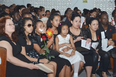 Relatives at Trevor Rose’s funeral service yesterday. 