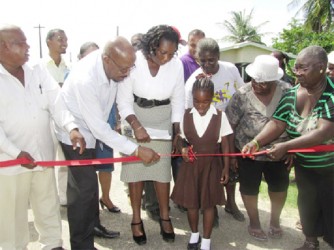 Minister of Local Government and Regional Development Norman Whittaker (second from left), along with residents commissions the Calcutta School Street (GINA photo)