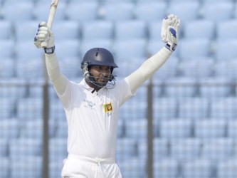 Kumar Sangakkara celebrates reaching his triple century. 