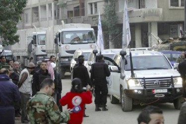 A United Nations and Syrian Arab Red Crescent aid convoy in a street in Homs city yesterday (Reuters/ SANA/Handout via Reuters)