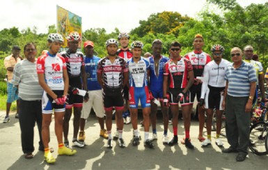 Winner’s Row The prize winners of yesterday’s R&R International sponsored 40-mile road race take a photo opportunity with the event’s organiser, Hassan Mohamed. (Orlando Charles photo) 