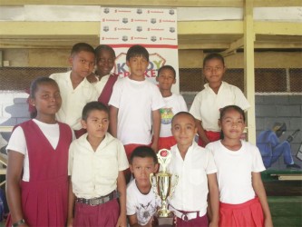 The members of the Kuru Kuru Primary School team which won the Highway Zone of the Scotiabank Kiddies Cricket Competition yesterday. 