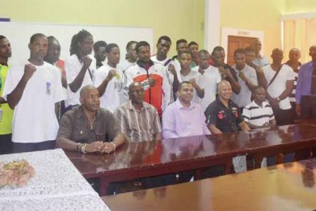 The officials along with the pugilists competing in the three-day, four-nation, International Goodwill tournament take a photo opportunity with Minister of Sport, Dr. Frank Anthony (seated centre).
