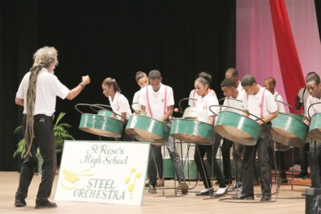 The St Rose’s High School Steel Orchestra performs in the steel band preliminaries during the Children’s Mashramani Competition Final at the National Cultural Centre yesterday. (Photo by Arian Browne)
