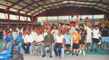 Director of Sport Neil Kumar, fourth from left, officials of the National Sports Commission and the Guyana Table Tennis Association and the players at the opening ceremony of the National Sports Commission-sponsored Mashramani table tennis tournament at the National Gymnasium on Saturday. 