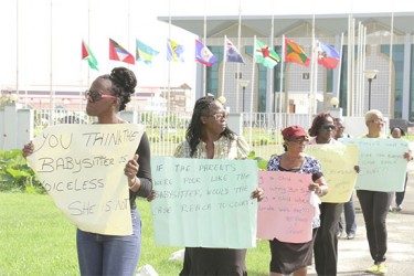 A section of the protestors circling the front of Guyana International Conference Centre in Liliendaal demonstrating against a court ruling handed down by a magistrate last week. 